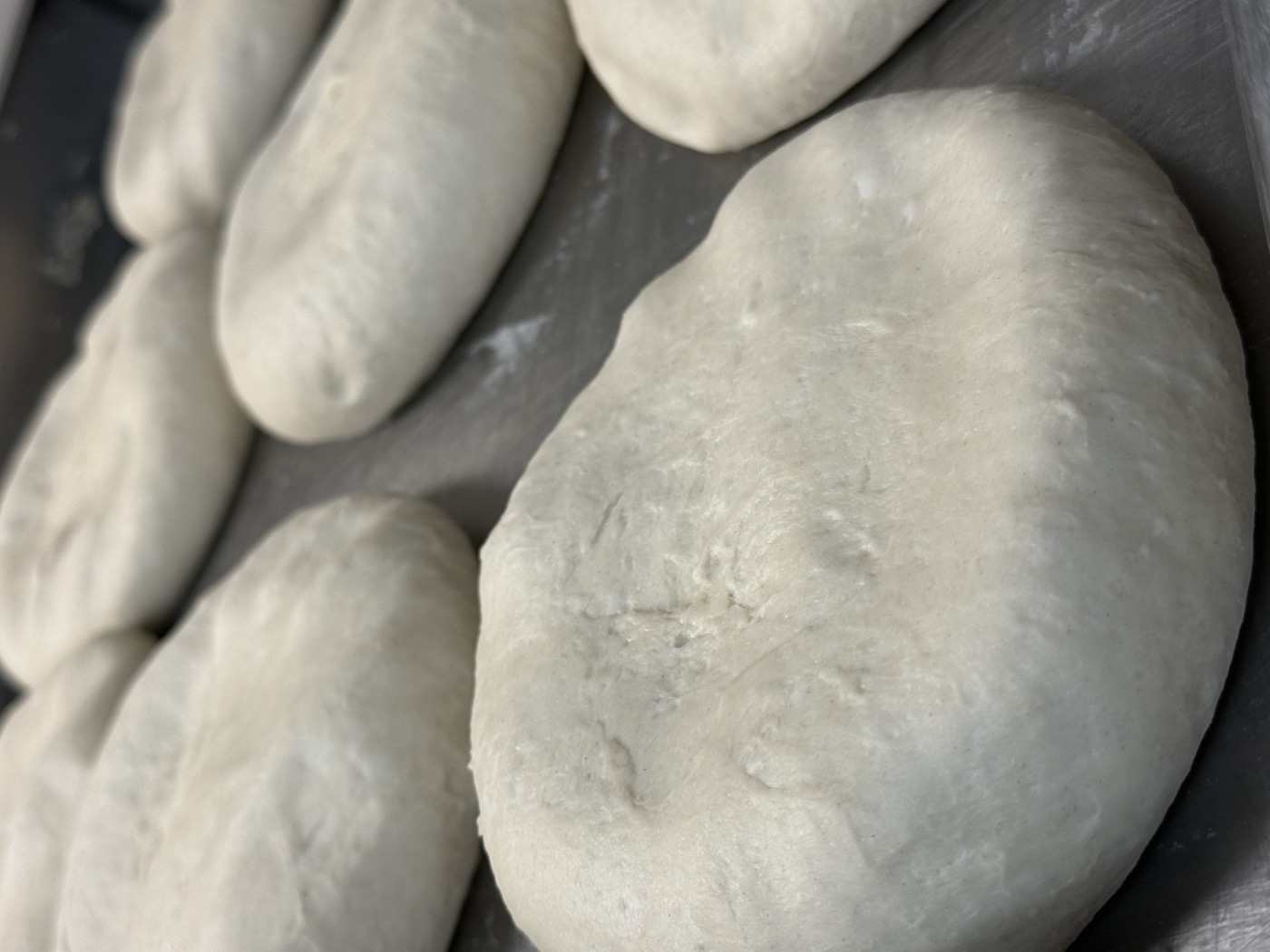 Fresh pizza dough hand-stretched at Vesuvios Pizza